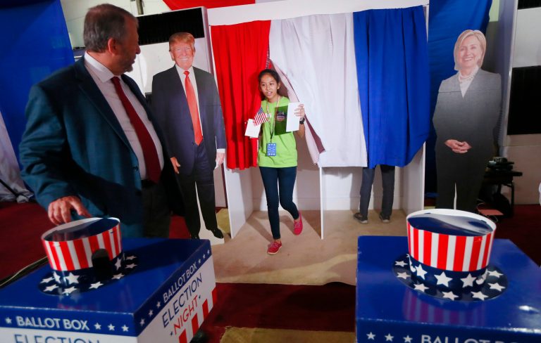 Tables show how Clinton received sharply lower percentages in the Outstate Midwest as compared to Obama in 2012. (AP Photo/Bullit Marquez)