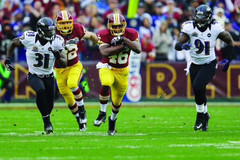 LANDOVER, MD - DECEMBER 09: Running back Alfred Morris #46 of the Washington Redskins carries the ball while being chased by strong safety Bernard Pollard #31 and outside linebacker Courtney Upshaw #91 of the Baltimore Ravens during the first half at FedExField on December 9, 2012 in Landover, Maryland.  (Photo by Rob Carr/Getty Images) *** Local Caption *** Alfred Morris; Bernard Pollard; Courtney Upshaw