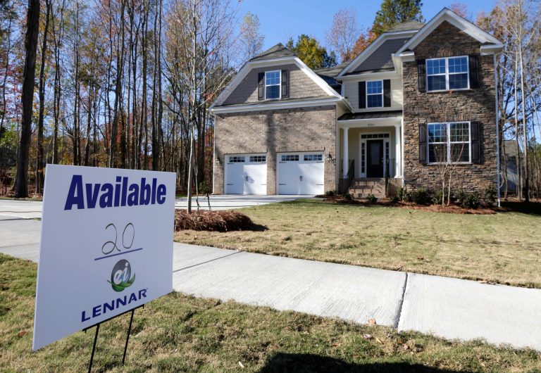 In this Nov. 14, 2013 photo, a home is advertised for sale in Matthews, N.C. The National Association of Realtors reports on sales of existing homes in November on Thursday, Dec. 19, 2013. (AP Photo/Chuck Burton)
