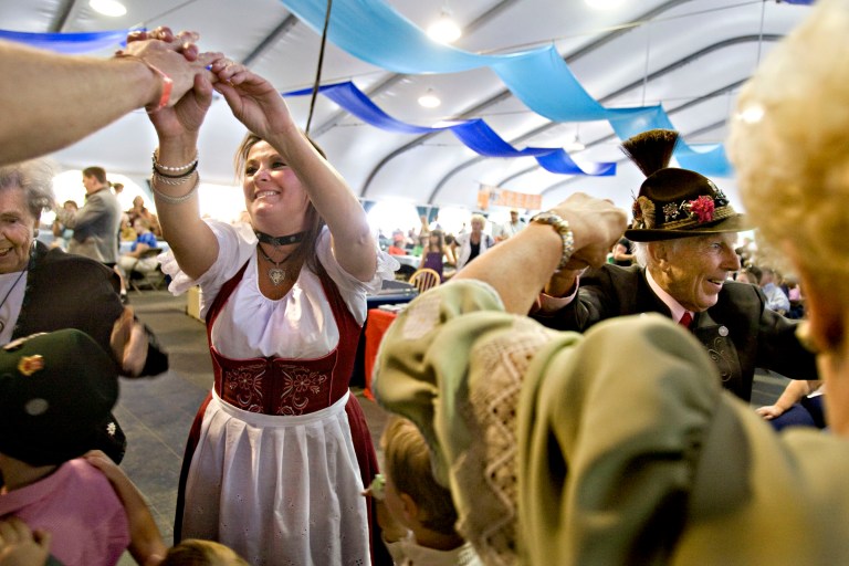 In this photo taken on Sept. 6, 2009, Cindy White, left, and Walter Schwemmer, right, dance to the Bavarian musical group Alpiners USA as part of the Oktoberfest celebration at Snowbird Mountain Resort in Utah. Utah's state liquor commission is tightening up on issuing permits for weekend events like Snowbird Ski Resort's annual Oktoberfest. (AP Photo/The Deseret News, Mike Terry)  SALT LAKE TRIBUNE OUT;  MAGS OUT