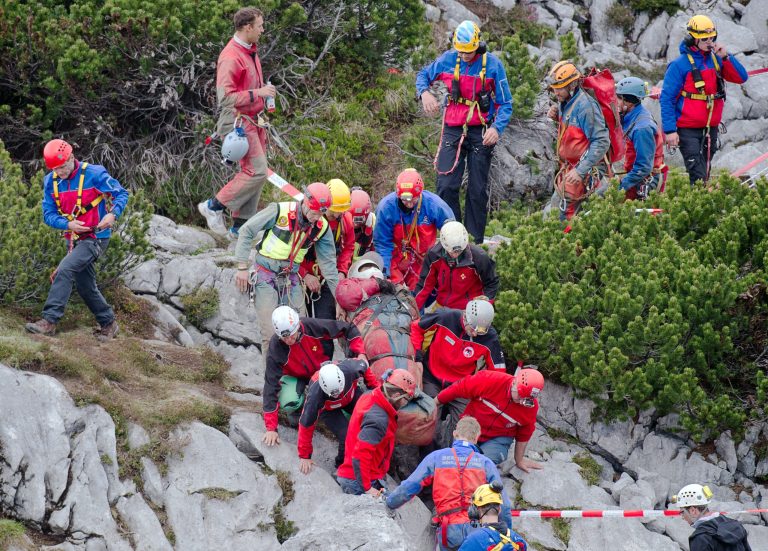 Mountain rescuers carry cave researcher Johann Westhauser , center, out of the Riesending cave near Marktschellenberg, southern Germany, Thursday June 19, 2014. The German cave researcher has been successfully brought to the surface after suffering head injuries in an accident deep underground nearly two weeks ago. Westhauser was injured June 8 while nearly 1,000 meters (3,280 feet) underground in the Riesending cave system in the Alps near the Austrian border.  (AP Photo/dpa,Nicolas Armer)