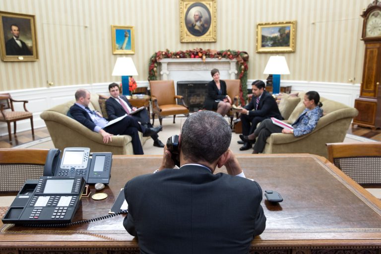 President Barack Obama talks with President Raul Castro of Cuba from the Oval Office, on December 16, 2014 in Washington. (Photo by Pete Souza/The White House)