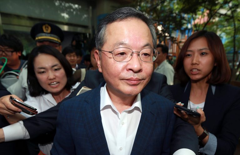 Newly-nominated South Korean Prime Minister Ahn Dai-hee leaves after a news conference about his resignation at the Government Complex in Seoul, South Korea, Wednesday, May 28, 2014. (AP Photo/Yonhap, Shin Jun-hee) KOREA OUT