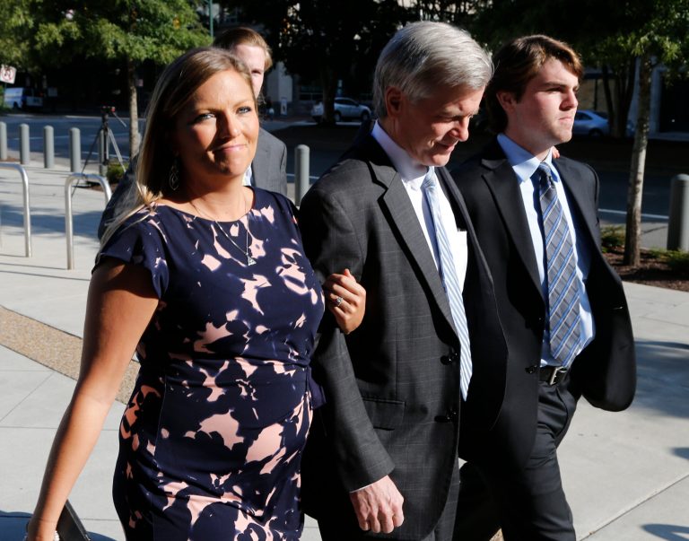 Former Virginia Gov. Bob McDonnell, center, arrives at federal court with his daughter Jeanine McDonnell Zubowsky, left, and son Bobby McDonnell, right, Friday, Aug. 29, 2014, in Richmond, Va. Jeanine McDonnell Zubowsky wrote a letter filed in federal court in support of her father in his upcoming sentencing. (AP Photo/Steve Helber)