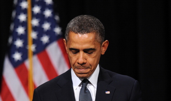 NEWTOWN, CT - DECEMBER 16:  U.S. President Barack Obama speaks at an interfaith vigil for the shooting victims from Sandy Hook Elementary School on December 16, 2012 at Newtown High School in Newtown, Connecticut. Twenty-six people were shot dead, including twenty children, after a gunman identified as Adam Lanza opened fire at Sandy Hook Elementary School. Lanza also reportedly had committed suicide at the scene. A 28th person, believed to be Nancy Lanza, found dead in a house in town, was also believed to have been shot by Adam Lanza. (Photo by Olivier Douliery-Pool/Getty Images)