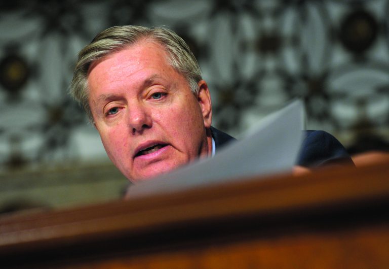 Sen. Lindsey Graham, D-S.C., holds a copy of a congressional letter urging the European Union to blacklist Hezbollah as he questions former Nebraska Sen. Chuck Hagel, President Barack Obama's choice for defense secretary, on Capitol Hill in Washington, Thursday, Jan. 31, 2013, during the Senate Armed Services Committee hearing on Hagel's nomination. Hagel refused to sign the 2006 letter when he was a Senator urging the European Union to declare Hezbollah a terrorist organization. (AP Photo/Susan Walsh)
