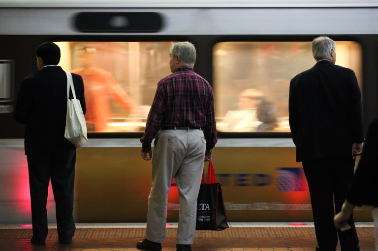 Commuters wait for a Metro train September 19, 2012