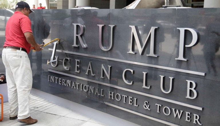 A man removes the word 