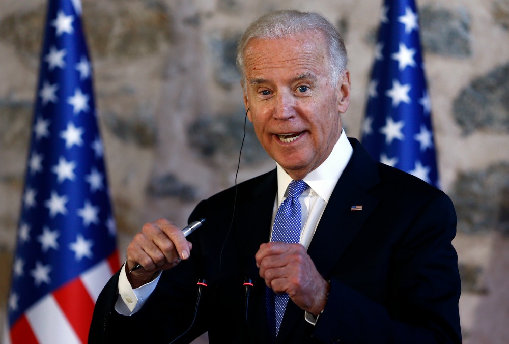 Biden defends immigration raids to Dems