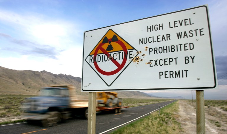 A state sign, riddled by shotgun blasts, stands along the highway leading to the Goshute Indian Tribe reservation in Skull Valley, Utah, Wednesday, May 3, 2006. (AP Photo/Douglas C. Pizac)