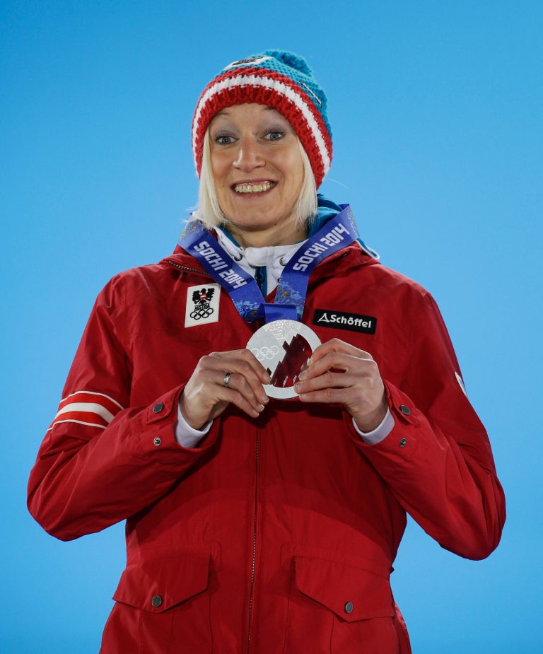 Women's normal hill ski jumping silver medalist Daniela Iraschko-Stolz of Austria smiles during the medals ceremony at the 2014 Winter Olympics, Wednesday, Feb. 12, 2014, in Sochi, Russia. (AP Photo/Morry Gash)