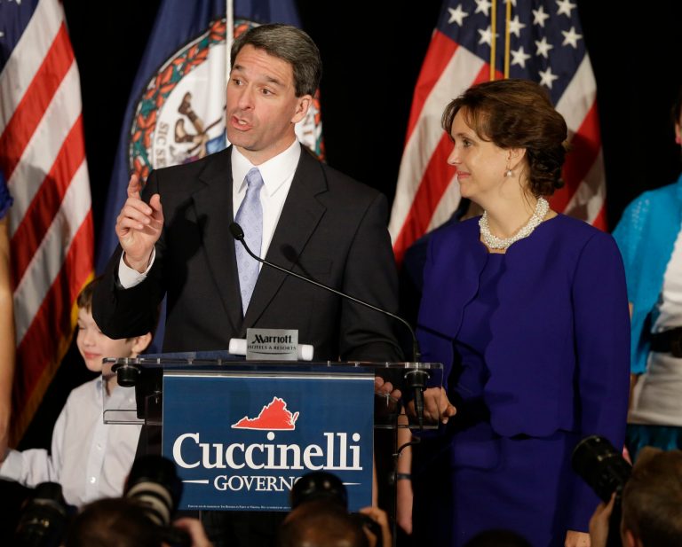 Republican gubernatorial candidate Virginia Attorney General Ken Cuccinelli delivers his concession speech with his wife, Teiro, during a rally in Richmond, Va. Cuccinelli was defeated by Democrat Terry McAuliffe. (AP Photo/Steve Helber)