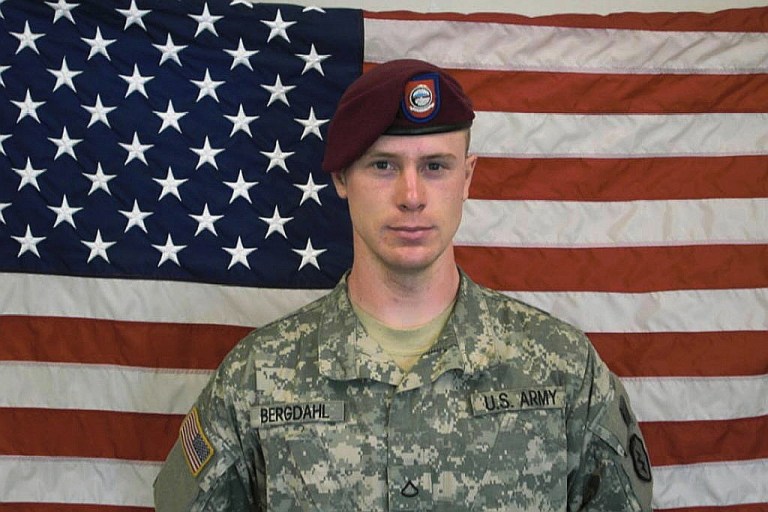 In this undated image provided by the U.S. Army, Sgt. Bowe Bergdahl poses in front of an American flag. U.S. officials say Bergdahl, the only American soldier held prisoner in Afghanistan, was exchanged for five Taliban commanders being held at Guantanamo Bay, Cuba, according to published reports. Bergdahl is in stable condition at a Berlin hospital, according to the reports. (Photo by U.S. Army via Getty Images)