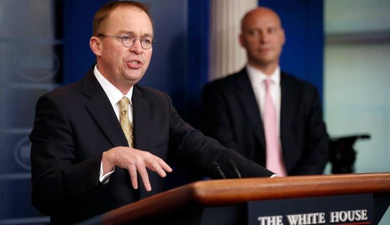 Director of the Office of Management and Budget Mick Mulvaney, left, speaks as Marc Short, White House director for legislative affairs, stands nearby during a press briefing at the White House, Saturday, Jan. 20, 2018, in Washington. (AP Photo/Alex Brandon)