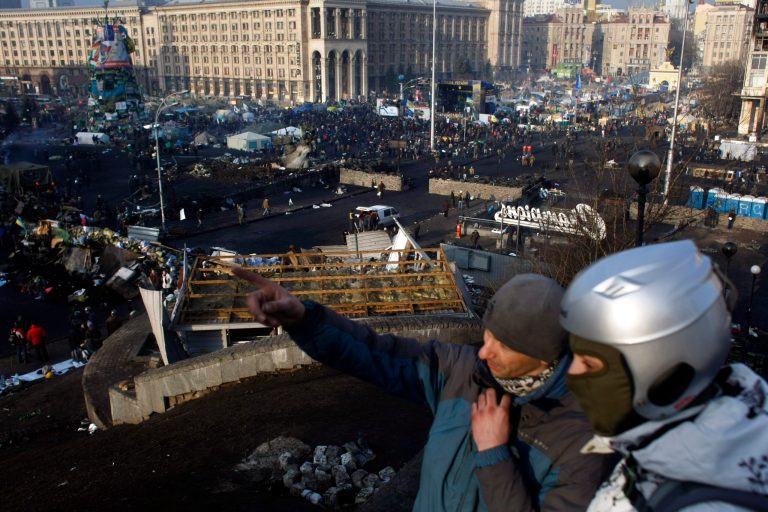 People gather at the Independence Square in Kiev, Ukraine, on Friday. (AP Photo/ Marko Drobnjakovic)