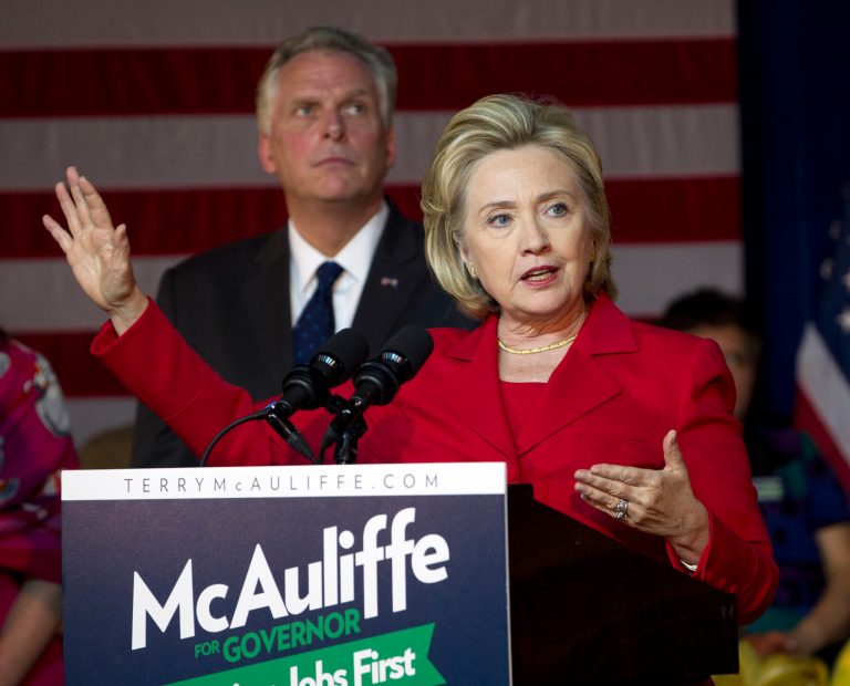 Former Secretary of State Hillary Clinton speaks at a campaign rally for Virginia gubernatorial candidate, democrat Terry McAuliffe, right, at the State Theater in Falls Church, Va., on Oct. 19. (AP File)