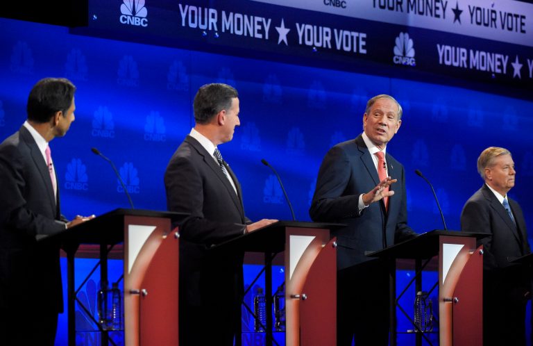 George Pataki, second from right, speaks as Republican presidential candidates Bobby Jindal, left, Rick Santorum, second from left, and Lindsey Graham look on during the CNBC Republican presidential debate. (AP Photo/Mark J. Terrill)