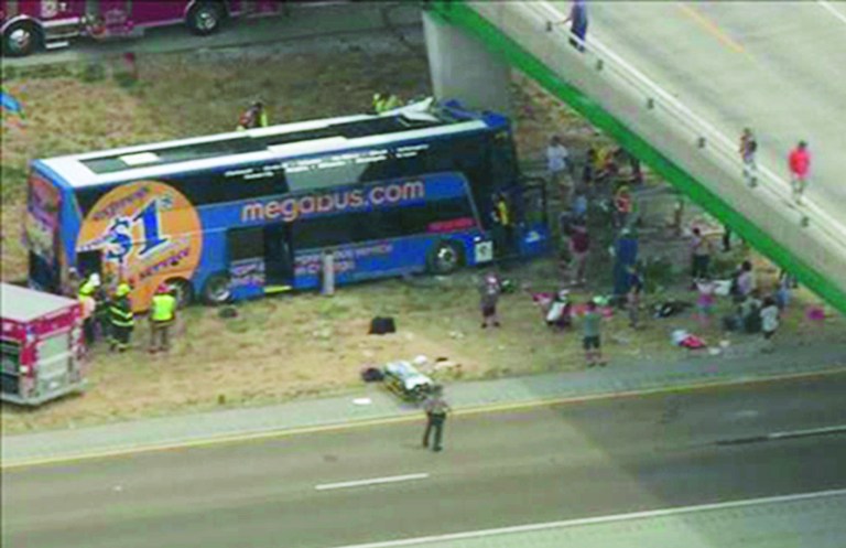 In this photo from video provided by KSDK-TV NewsCenter5 in St. Louis, first responders work the scene of a charter bus crash on Interstate 55 near Litchfield, Ill. Thursday, Aug. 2, 2012. The double-decker Megabus carrying 81 passengers blew a tire and slammed head-on into a concrete bridge support pillar. Four people injured in the crash were flown by helicopter to a trauma center, others were treated at local hospitals. (AP Photo/Courtesy KSDK-TV NewsCenter5 in St. Louis)
