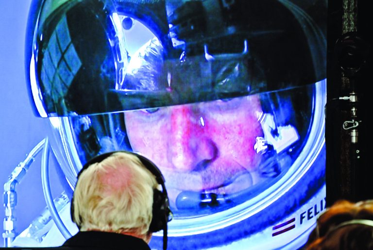 In this photo provided by Red Bull, pilot Felix Baumgartner of Austria is seen in a screen at mission control center in the capsule during the final manned flight for Red Bull Stratos in Roswell, N.M. on Sunday, Oct. 14, 2012. Baumgartner plans to jump from an altitude of 120,000 feet, an altitude chosen to enable him to achieve Mach 1 in free fall, which would deliver scientific data to the aerospace community about human survival from high altitudes.(AP Photo/Red Bull, Stefan Aufschnaiter)
