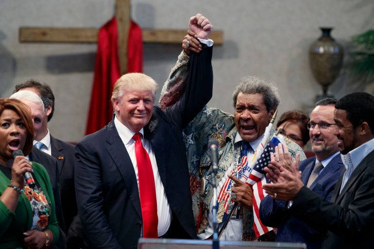 Boxing promoter Don King, right, holds up the hand of Republican presidential candidate Donald Trump during a visit to the Pastors Leadership Conference at New Spirit Revival Center, Wednesday, Sept. 21, 2016, in Cleveland, Ohio. (AP Photo/ Evan Vucci)