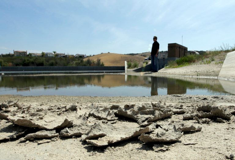 Rich Kissee, Operations Manager for the Santa Margarita Water District, stands on the edge of a water runoff reservoir, Thursday, July 2, 2015, in Rancho Santa Margarita, Calif. (AP Photo)Â 