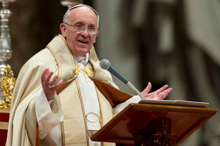 Pope Francis greets the faithful as he tours St. Peter's Square during his weekly general audience at the Vatican on Nov. 20. (AP Photo/Gregorio Borgia)