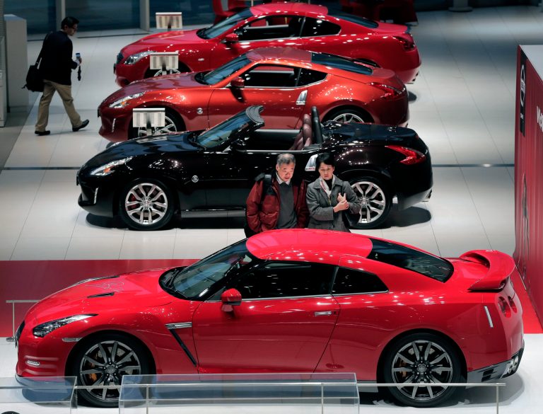   FILE - In this Nov. 6, 2012 file photo, visitors inspect sports cars at a gallery inside the Nissan Motor Co. headquarters in Yokohama, near Tokyo. Japanese manufacturers are increasingly gloomy about their prospects as exports take a hit from antagonisms with China over a territorial dispute, a quarterly survey by Japan's central bank showed Friday, Dec. 14. (AP Photo/Itsuo Inouye, File)  