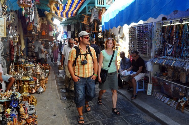 Tourists in a market in Tunis. (AP photo: Hassene Dridi)