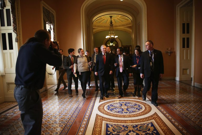 Flanked by members of the media, U.S. Senate Majority Leader Sen. Mitch McConnell (R-KY) (C) walks back to his office after the Senate Republican weekly policy luncheon at the U.S. Capitol Jan. 20, 2015 on Capitol Hill in Washington, D.C. (Photo by Alex Wong/Getty images)