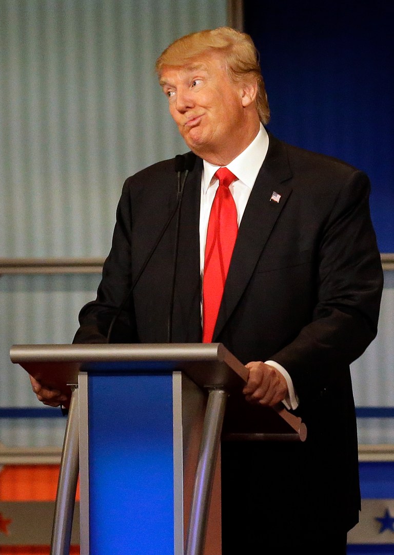 Donald Trump reacts during Republican presidential debate at Milwaukee Theatre, Tuesday, Nov. 10, 2015, in Milwaukee. (AP Photo/Jeffrey Phelps)