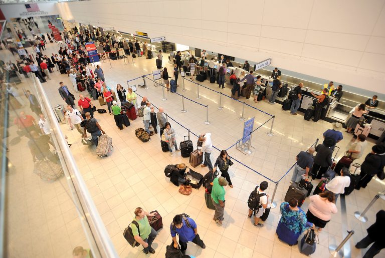 In this Thursday, Sept. 12, 2013 photo, long lines of passengers wait in Concourse D of Baltimore-Washington International Thurgood Marshall Airport, in Linthicum, Md., after many flights were either delayed or canceled because of a lightning strike to the airport's air traffic control tower, leading controllers to stop all arrivals and departures at the airport for more than two hours. The lightning strike, which also injured an air traffic controller, is prompting the Federal Aviation Administration to examine hundreds of air traffic control towers nationwide, the agency told The Associated Press. Officials will be looking for problems with the systems that protect the towers from lightning strikes. (AP Photo/The Capital, Paul W. Gillespie)