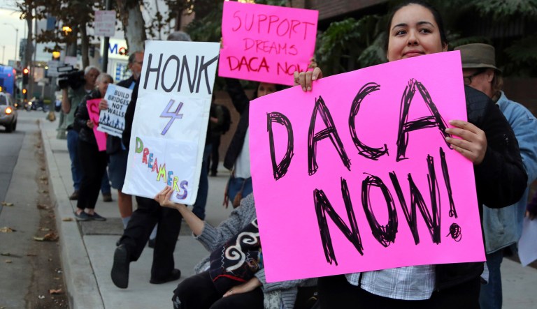 Demonstrators urging the Democratic Party to protect the Deferred Action for Childhood Arrivals Act program. (AP Photo/Reed Saxon)