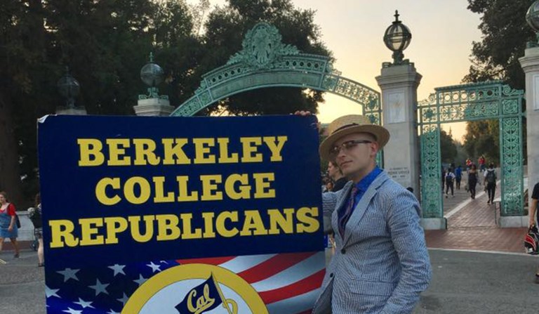 Troy Worden poses with a College Republican chapter sign at Berkeley (via Facebook).