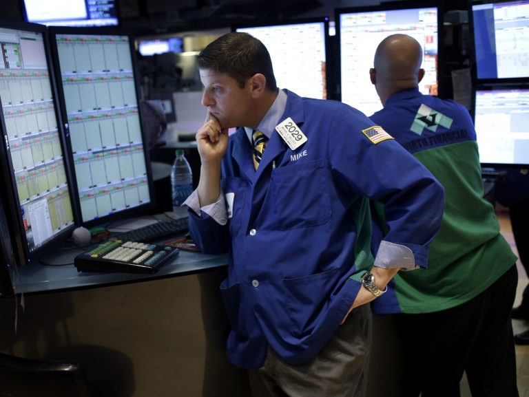   In this Sept. 3, 2013, photo, traders work on the floor at the New York Stock Exchange in New York. Stock markets were tentative Friday, Sept. 6, 2012, ahead of the latest U.S. jobs report, the most important monthly indicator for the world's largest economy. (AP Photo/Seth Wenig)  