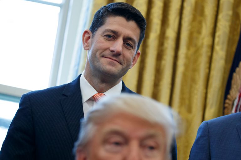 House Speaker Paul Ryan of Wis. watches as President Donald Trump signs House Joint Resolution 41, Tuesday, Feb. 14, 2017, in the Oval Office of the White House in Washington. (AP Photo/Evan Vucci)