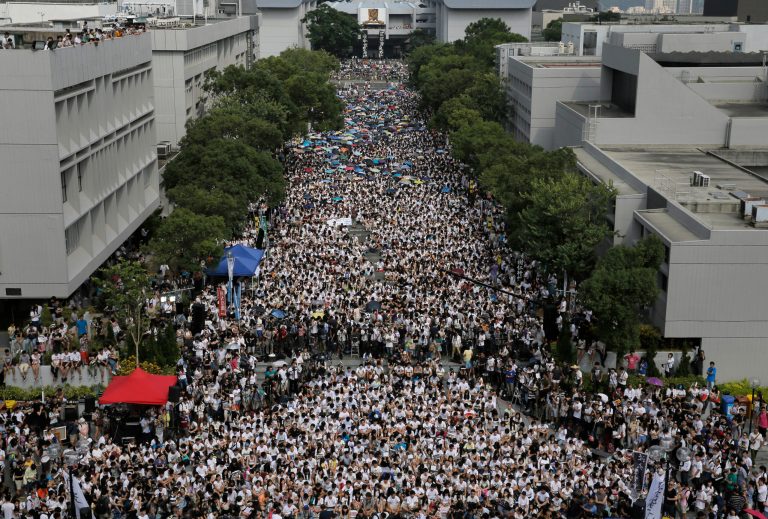 Students attend a rally at the Chinese University of Hong Kong campus in Hong Kong, Monday, Sept. 22, 2014. Thousands of Hong Kong students boycotted classes Monday to protest Beijing's decision to restrict electoral reforms in a weeklong strike marking the latest phase in the battle for democracy in the southern Chinese city. (AP Photo/Vincent Yu)