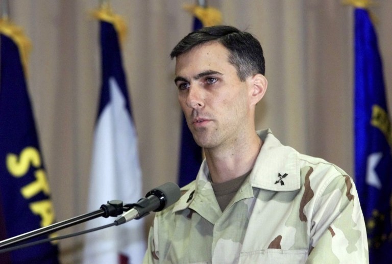 Captain Jason Amerine, 5th Special Forces Group, adresses the audience during a September 11th Commemorative Ceremony at the Landstuhl Regional Medical Center in Landstuhl, southern Germany, on Tuesday Dec.11, 2001. (AP Photo/Thomas Kienzle)