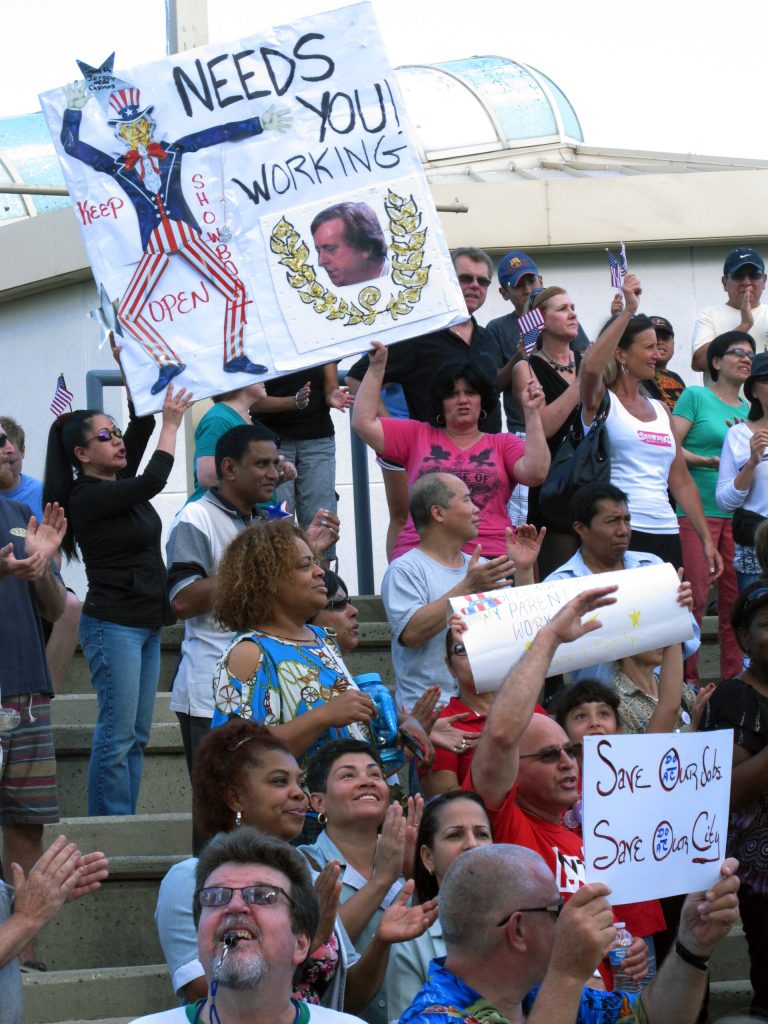 This July 24, 2014 photo shows casino workers protesting in Atlantic City, N.J. against the planned shutdown of as many as three casinos here by September. The Maryland Live! casino is holding a job fair on Aug 1-2 for soon-to-be-laid off workers in Atlantic City who are interested in relocating to Maryland. (AP Photo/Wayne Parry)