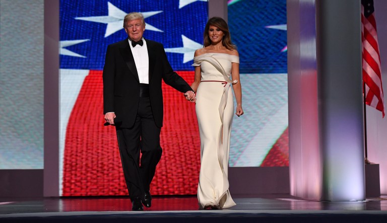 President Trump and first lady Melania Trump at one of the inaugural balls in Washington. On Friday, Melania Trump will donate the white gown she wore to the Smithsonian's National Museum of American History, continuing a long tradition of first ladies donating their inauguration dresses. (Kevin Dietsch/Pool via Bloomberg)