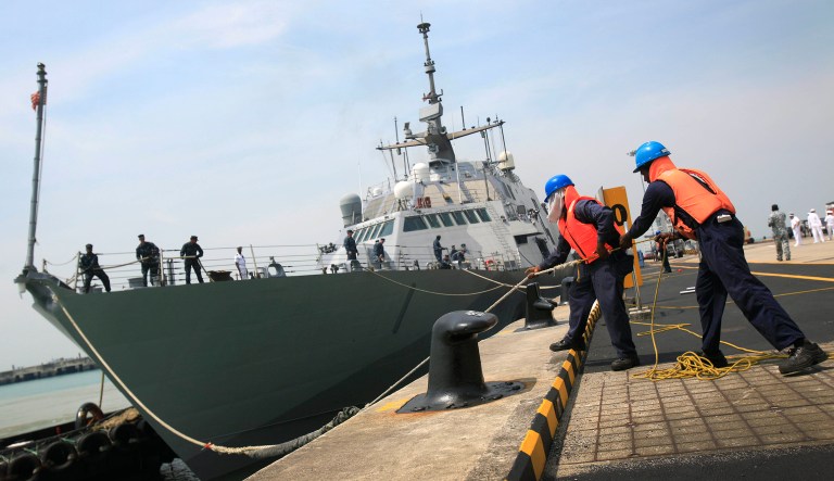 The Navy had planned to induct the 11 ships -- including five destroyers, three cruisers and a littoral combat ship -- between November and February but will be forced to delay the timeline. (AP Photo/Wong Maye-E)