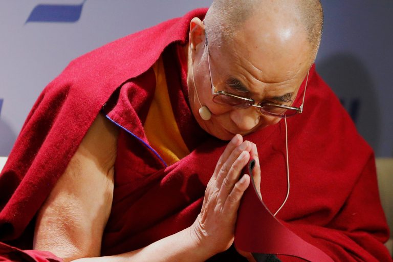 Tibetan spiritual leader the Dalai Lama acknowledges the audience before speaking at an event entitled: 