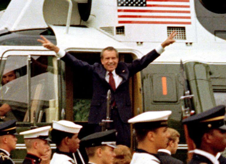 President Richard Nixon says goodbye outside the White House Friday, August 9, 1974, as he prepares to board a helicopter for a flight to nearby Andrews Air Force Base. (AP Photo/Bob Daugherty)