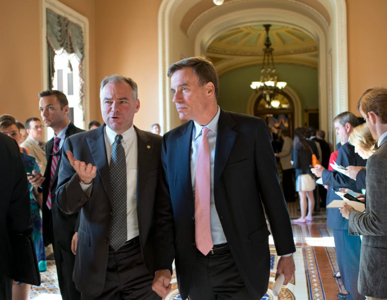 Virginia's two senators, Sen. Mark Warner, right, and Sen. Tim Kaine, shrugged off questions Tuesday into whether McDonnell should step down from office amid a FBI probe into his relationship with businessman Jonnie Williams. (AP/J. Scott Applewhite)