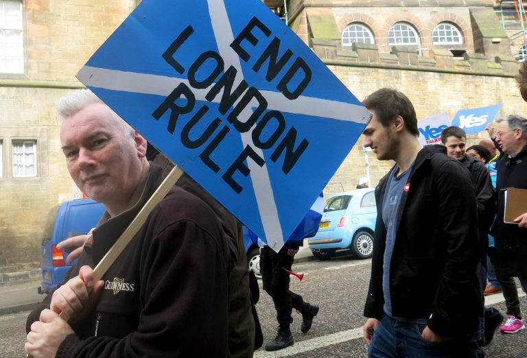 FILE - In this March 15, 2014 file photo, a demonstrator carries a sign during a pro-independence march in Edinburgh, Scotland. A Sept. 18, 2014 referendum will determine if Scotland becomes independent of the United Kingdom. (AP Photo/Jill Lawless)