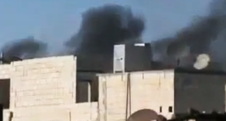   In this image made from amateur video released by the Ugarit News and accessed Wednesday, June 13, 2012, purports to show black smoke rising from buildings in Homs, Syria. Fireballs of orange flames exploded over the central city of Homs, where Syrian forces fired a continuous rain of shells that slammed into the rebel-held neighborhoods of Khaldiyeh, Jouret al-Shayyah and the old city. (AP Photo/Ugarit News via AP video) TV OUT, THE ASSOCIATED PRESS CANNOT INDEPENDENTLY VERIFY THE CONTENT, DATE, LOCATION OR AUTHENTICITY OF THIS MATERIAL  