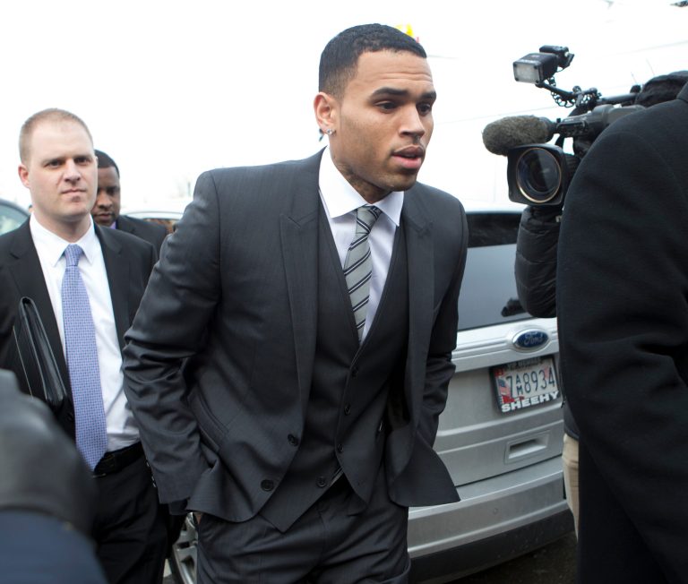 FILE - This Jan. 8, 2014 file photo shows singer Chris Brown, right, arriving at the District of Columbia Superior Court in Washington. After a brief postponement, singer Chris Brown's trial on an assault charge is scheduled to begin in Washington. Brown's trial had been set for Monday but was delayed while lawyers tried to work out whether his bodyguard will testify. It's unclear whether the trial will start Wednesday, as Brown's lawyers seem to want, or if further legal maneuvering will delay it.  (AP Photo/Manuel Balce Ceneta, File)