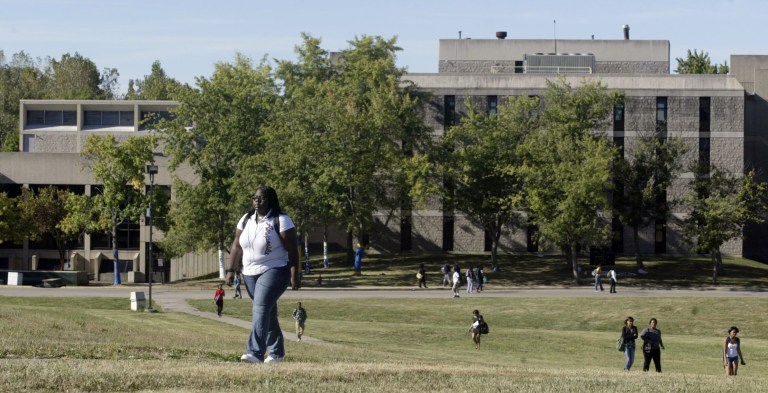 FILE - In this Sept. 9, 2010 file photo, students at Wilberforce University walk across campus in Wilberforce, Ohio. The historically black school founded in 1856 could lose accreditation. Alumni of the country's oldest historically black private university are committing money and other support to help the southwestern Ohio school fight to survive amid possible accreditation loss, financial deficits and low enrollment. (AP Photo/Dayton Daily News/Lisa Powell, File) NO SALES