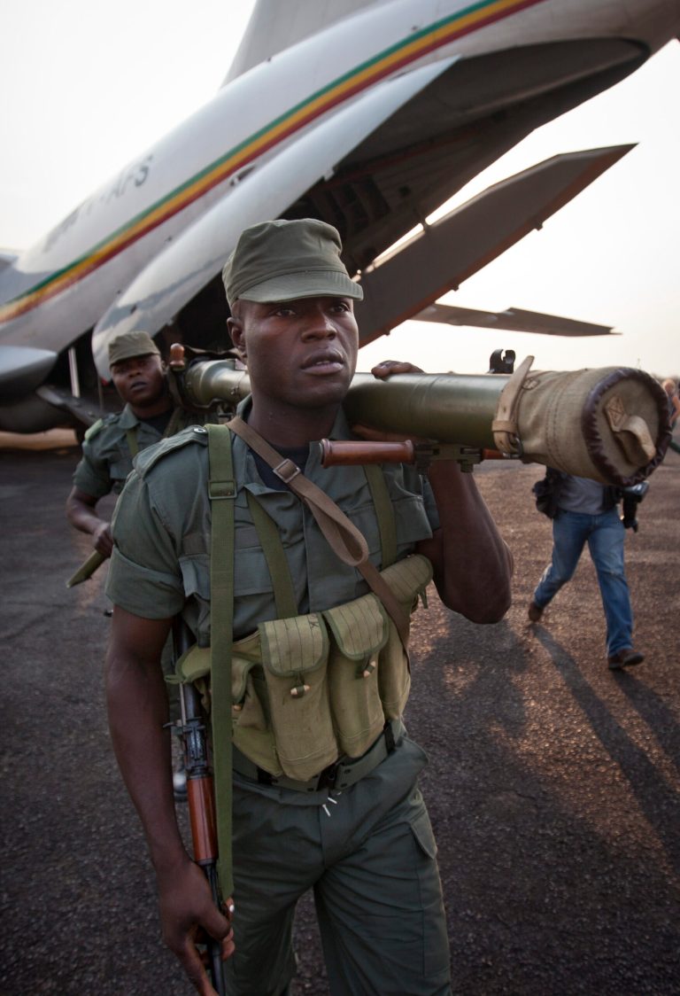   Soldiers from the Republic of Congo, operating under a multinational central-african regional mandate, arrive by airplane to boost existing forces, at an airport in Bangui, Central African Republic Monday, Dec. 31, 2012. Rebels in the Central African Republic on Monday rejected appeals for them to halt their advances and to negotiate to form a coalition government. (AP Photo/Ben Curtis)  