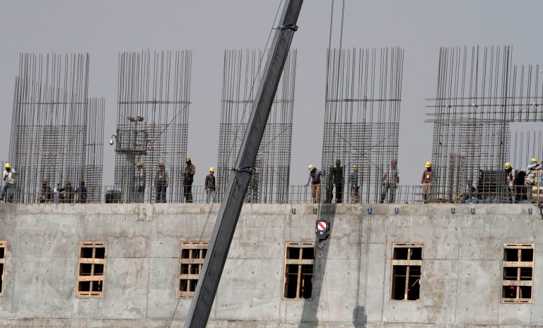 Construction workers install steel reinforcement bars on a building to be used by the Afghan National Army in Kabul on Tuesday, Oct. 8, 2013. The site is just one of many construction projects in the capital, where skilled workers earn about $20 per day and laborers earn around $10 daily. (AP Photo/Rahmat Gul)