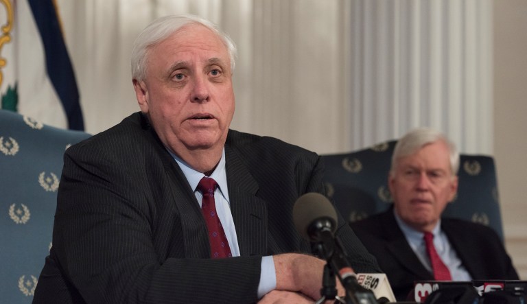 In this photo from Feb. 27, Gov. Jim Justice (left) speaks during a news conference at the capitol building in Charleston, W.Va.. Justice said Tuesday he is offering teachers and school service personnel a revised 5 percent pay raise in the first year to end their statewide walkout. (Craig Hudson/Charleston Gazette-Mail via AP)